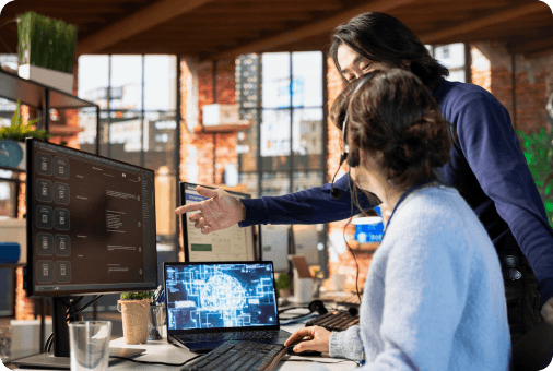 TedIT engineers reviewing AI-assisted code on screen